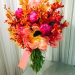 Coral and Magenta Peony, Gold and Red Mokara Orchids in Apothecary Footed Vase by Glenwood Weber Design