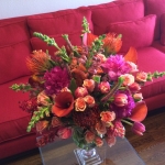 Magenta Peony, Mango Callas, Ilse Peach Spray Roses, Pink Veronica, Carmine Snap Dragons in Crystal Trophy Urn Sunset Colors by Glenwood Weber Design