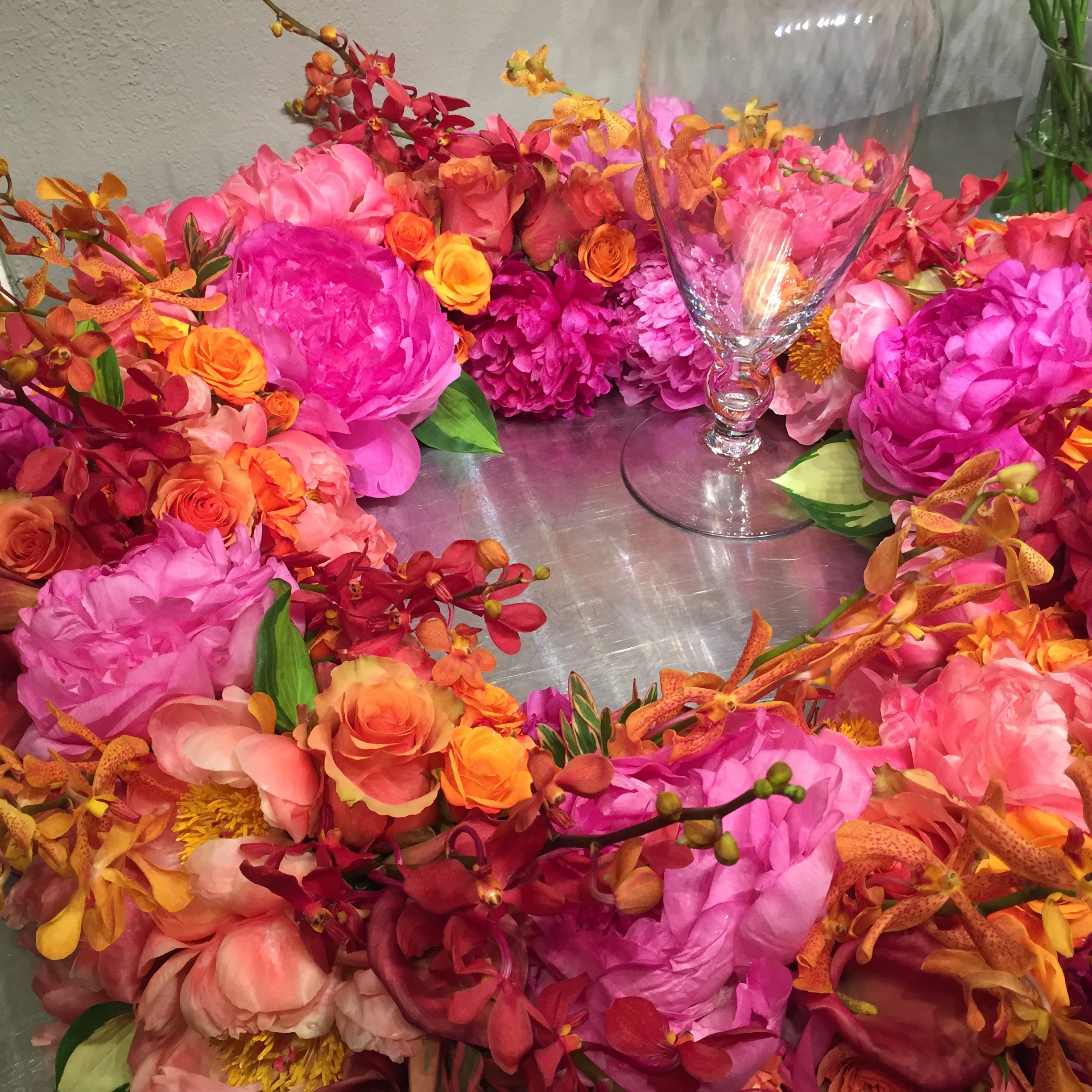 Sympathy Wreath with Pink, Hot Pink and Coral Peonies, Red and Orange Mokara, Orange Sweetheart and Samba Roses